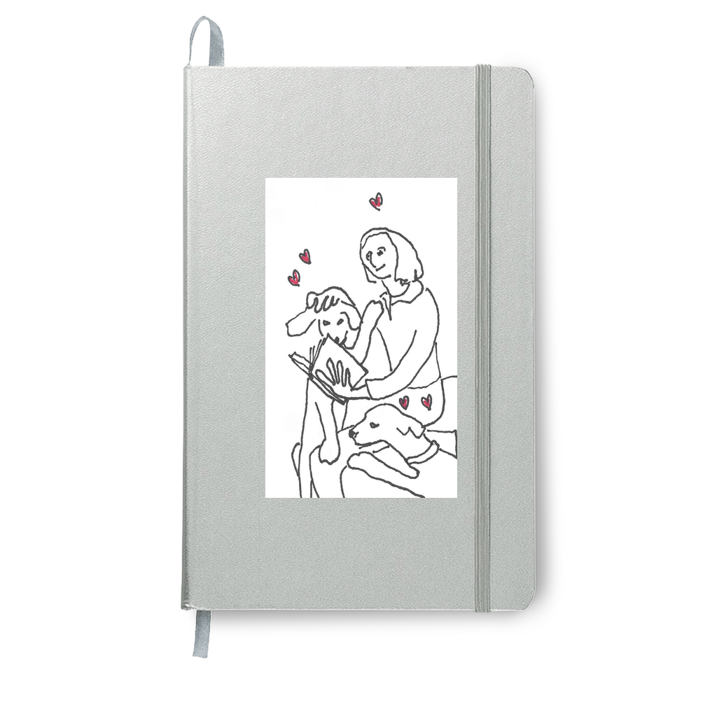 This silver journal book of On Being Idolized enhances the black and white image of a girl reading to her adored dogs. Red hearts float in the air to let everyone know they are loved.