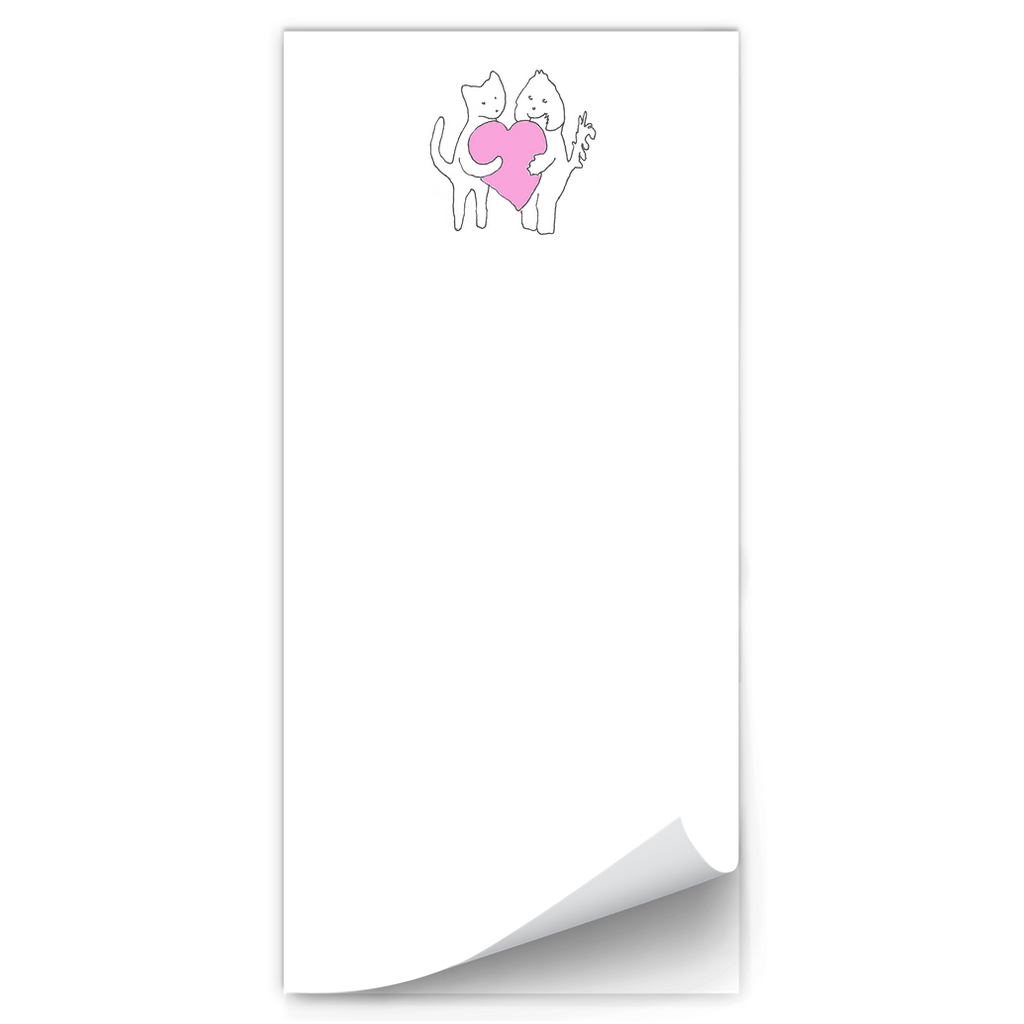 Sharing A Big Heart magnetic notepad features white paper with a dog and cat holding a large pink heart centered at the top of the pad. Art by Janet Lee Chauncey. Notepad by Chauncey Art Collective.
