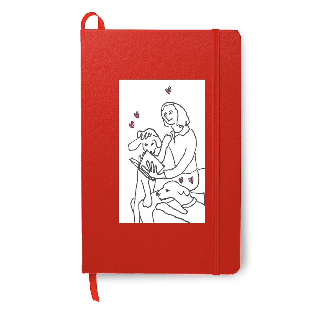 On Being Idolized printed on a red journal book enhances the feeling of love being felt by a girl as she reads to her dogs.