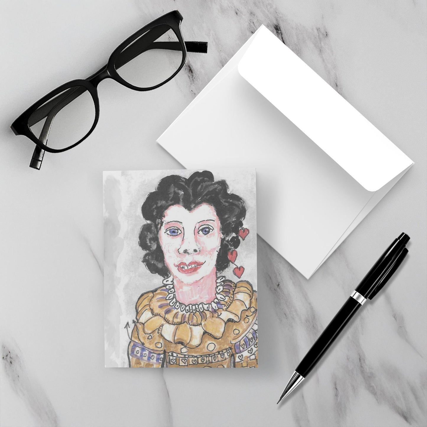 On a white marble backdrop the card is face up with its envelope, a pen and reading glasses.