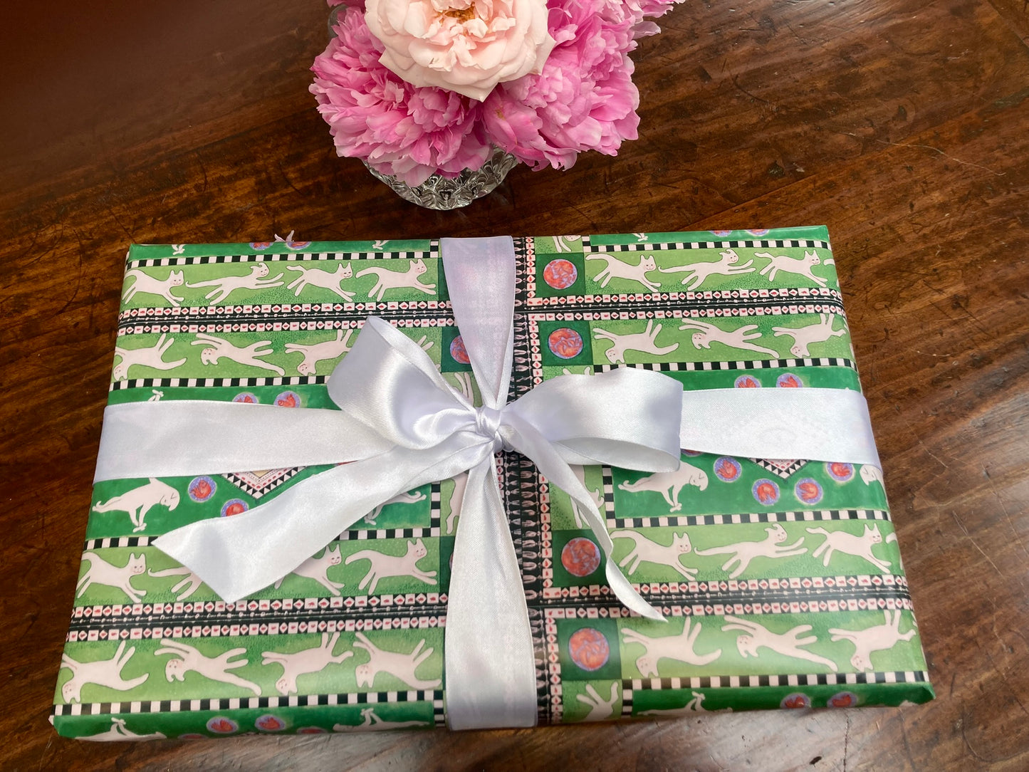 Mockup of package wrapped in the large size image of Presentation Cats Gift Paper.