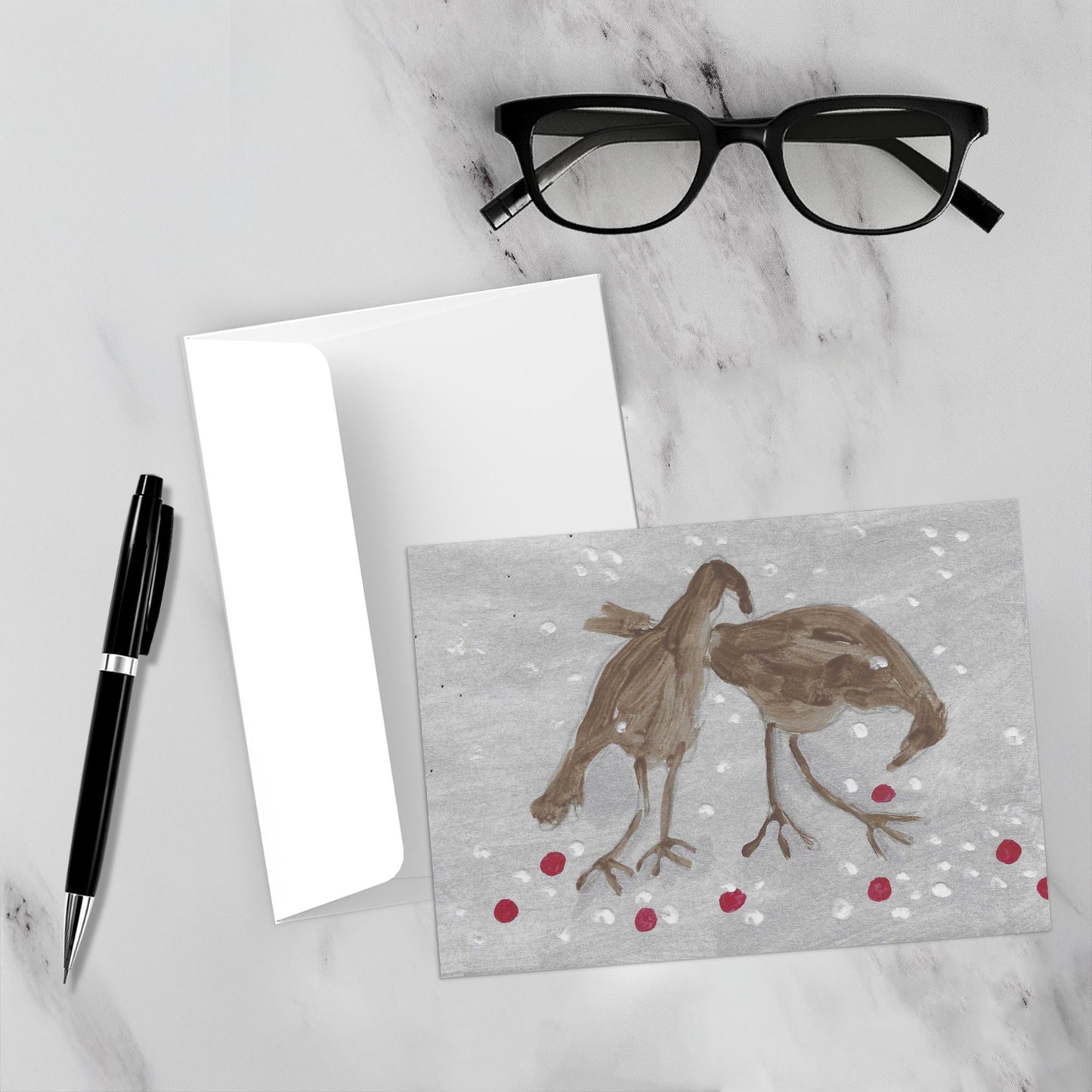 Birdie Treats card front and its envelope are on a marble surface.