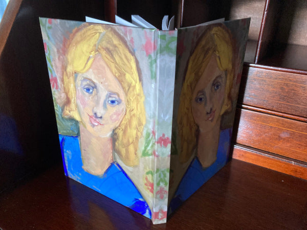 Front and back mirror images of Yellow Haired Girl journal.