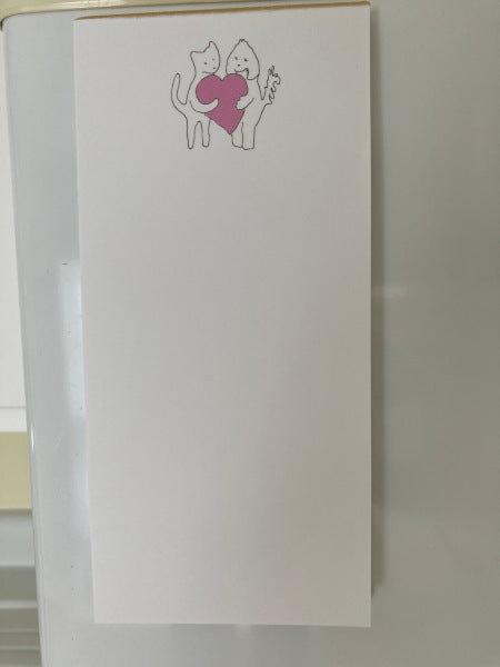 Mockup of Sharing A Big Heart magnetic notepad on a white refrigerator.