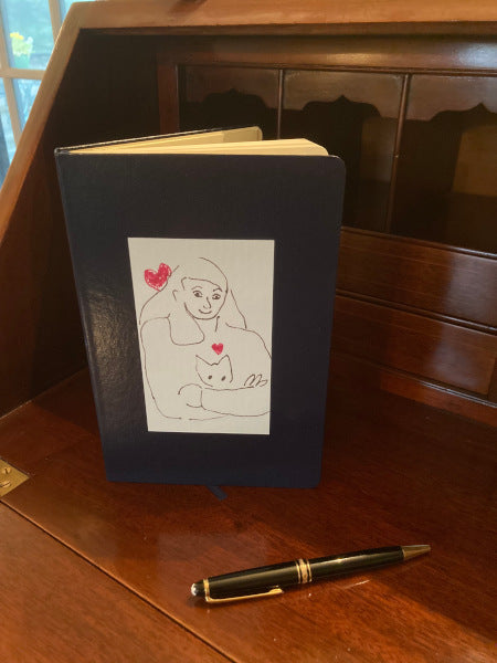 The black journal really offsets the black, red and white image of Armful of Love. The girl is holding her cat in a loving embrace.