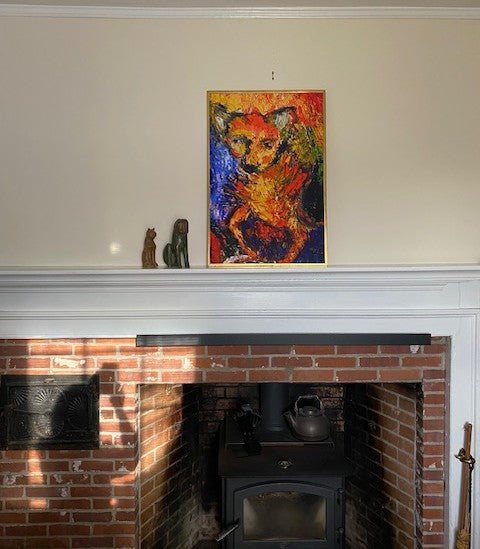 The vivid colors of the Pepito art print come alive set on top of the mantle with a off white wall color in the background.