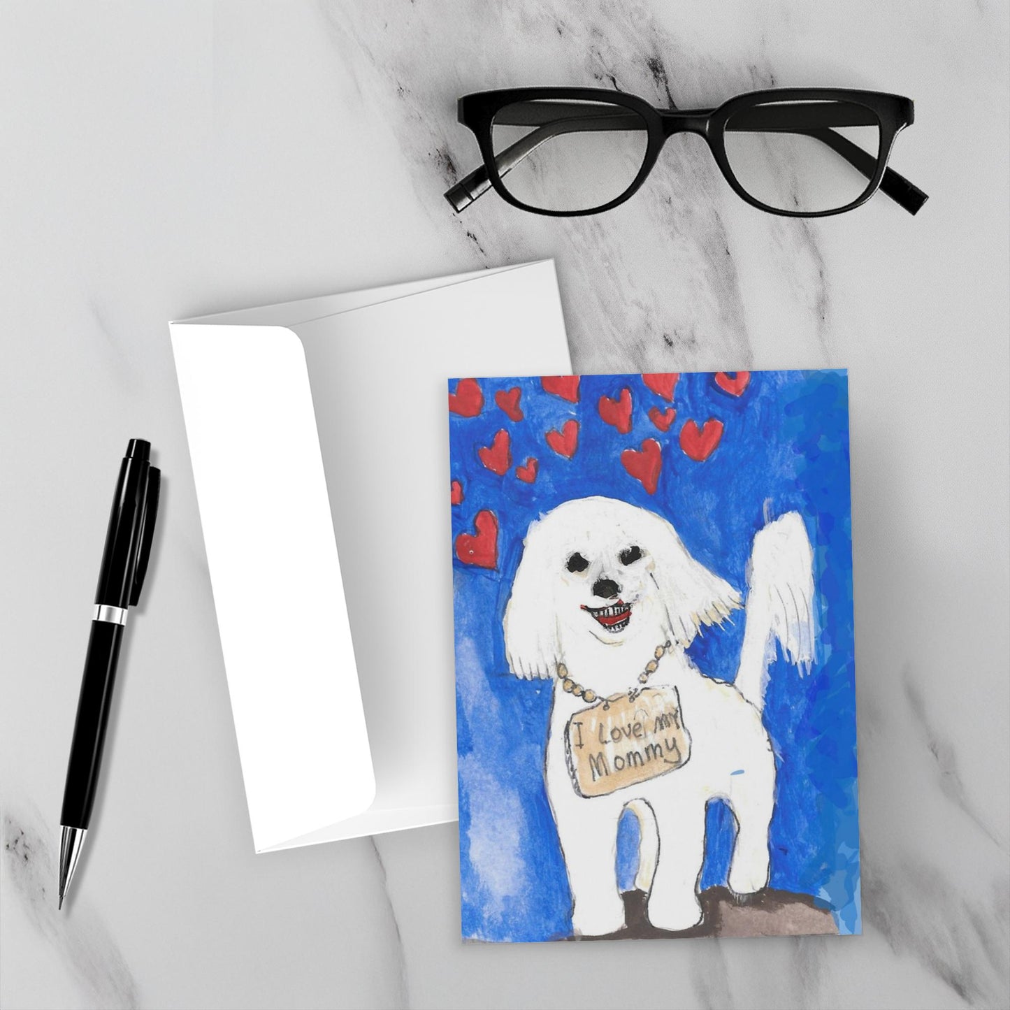 The happy face of the Maltese dog is facing upright on a white marble backdrop accompanied by the envelope, a pen and reading glasses.
