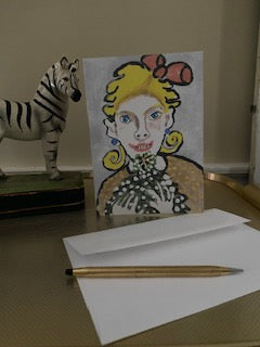 Mockup of A Beautiful Feeling Christmas card with envelope, gold pen and a zebra figurine.