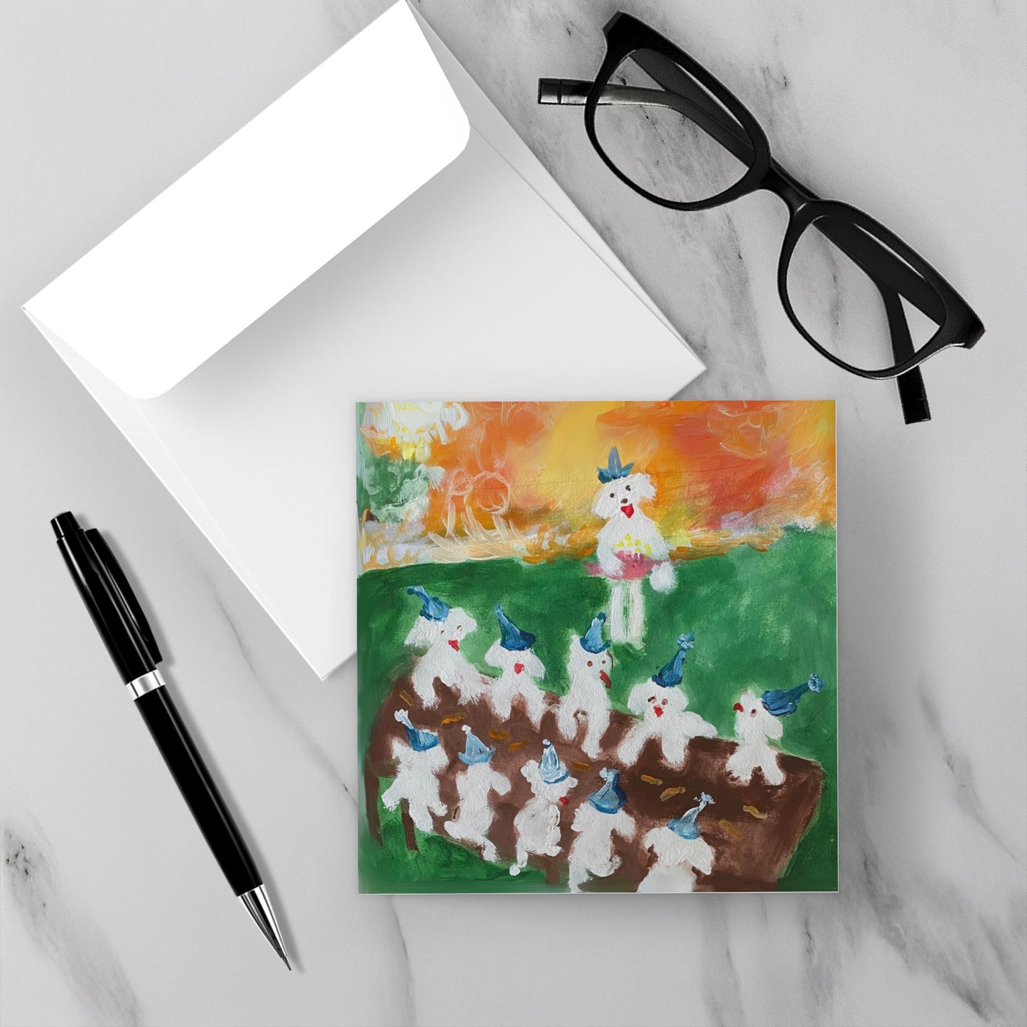 Mock up of the happy birthday card Birthday Picnic set on a white marble backdrop with its envelope.