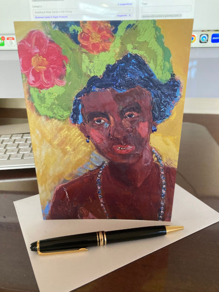Mock up of the colorful, all occasion greeting card, Lady In Hat with it's envelope and a black fountain pen.