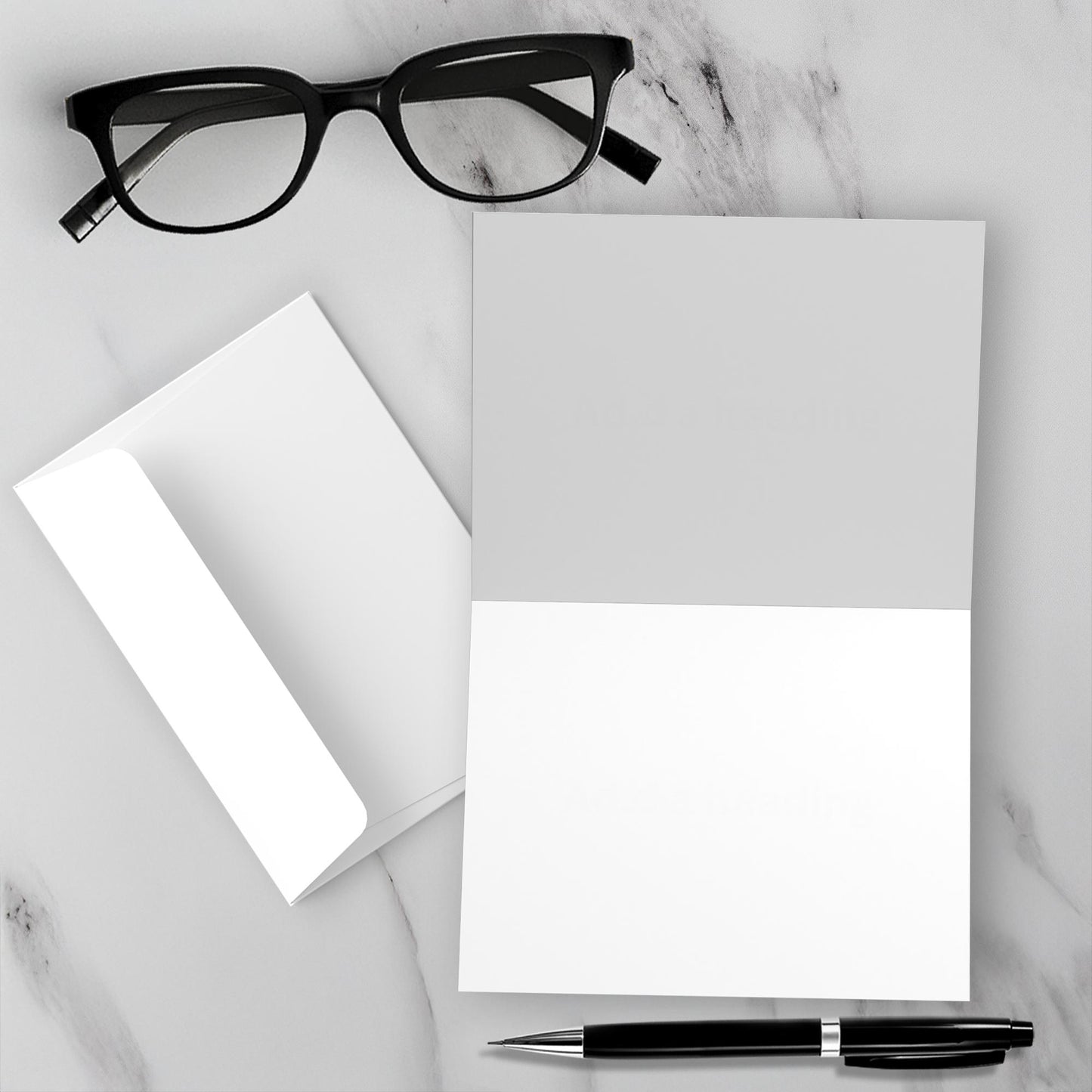 The blank inside of Eagle On Duty summer greeting card on a white marble surface with a pen and glasses.