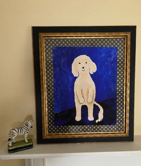 Ollie Stands Up art print is seen here in a black frame with gold and black checkered matting. The cobalt blue background offsets the Maltese dog nicely.