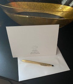 A mock up of the rear of the card along with it's envelope by the golden bowl.