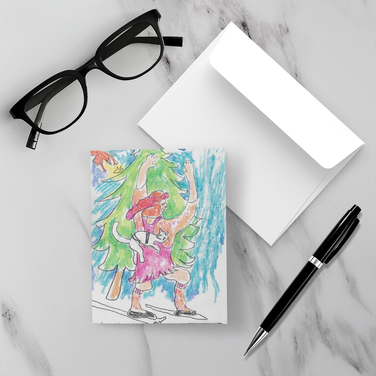 Skiing Caspar card with envelope on a white marble surface with glasses and a pen
