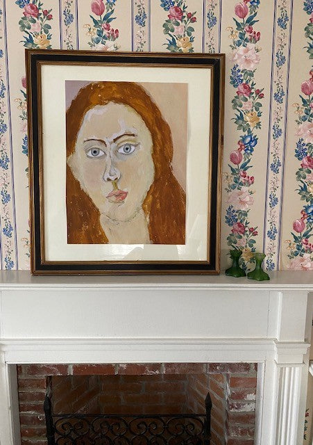 Portrait Girl art print in a black and gold frame with white matte resting on a mantle with flowery wallpaper behind.  Chauncey Art Collective.
