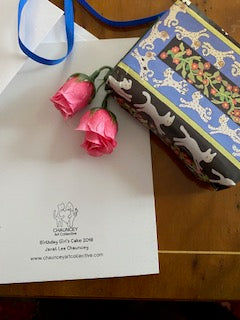 Mock up shows a gift wrapped in Cats In The Garden gift wrap.