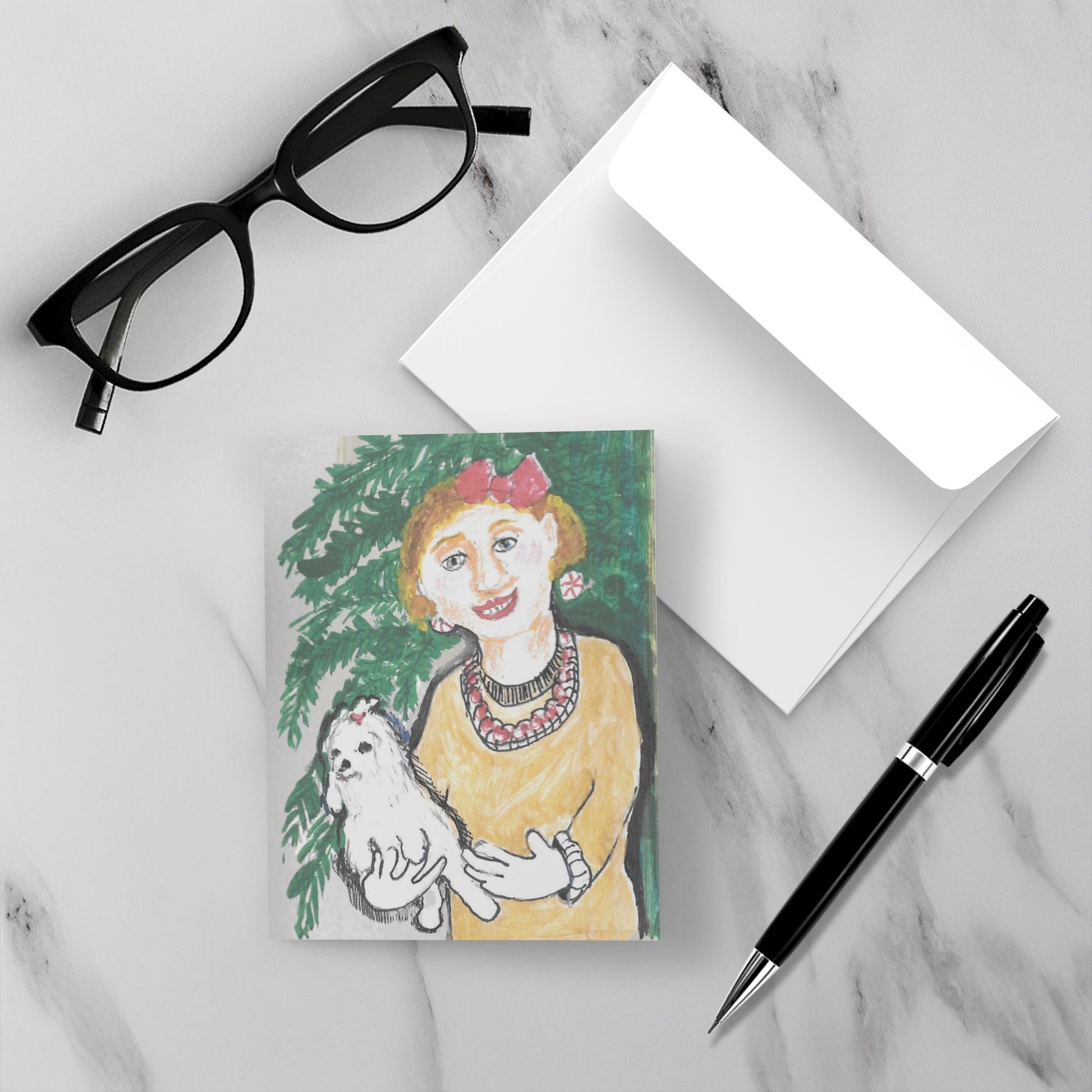 Greeting card with envelope of Together By The Tree by Janet Lee Chauncey on a marble surface