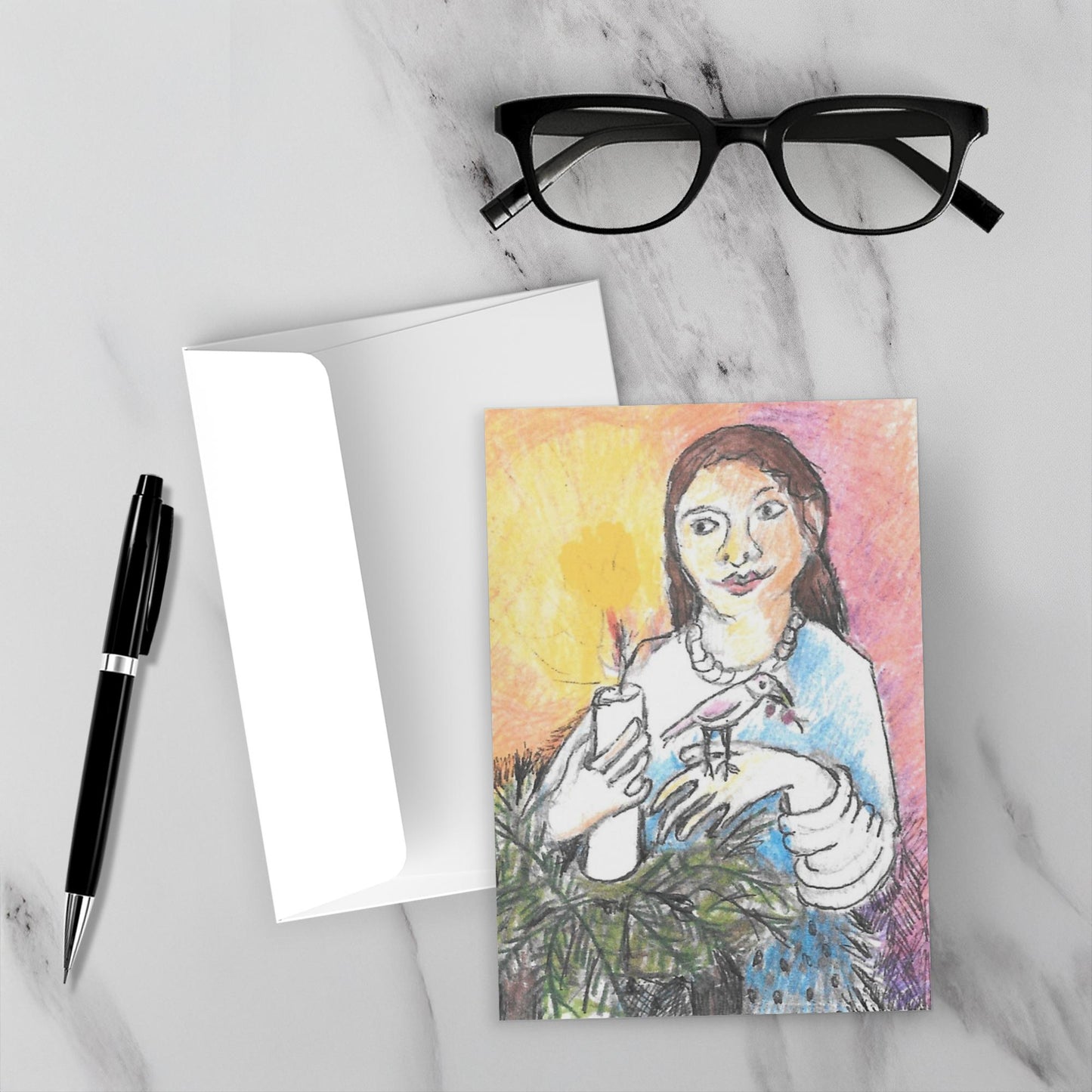 Greeting card with a colorful illustration of a woman holding a candle, placed on a marble surface with a pen and glasses.