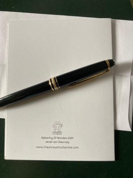 Another mock up of the back of the holiday card along with a black fountain pen.