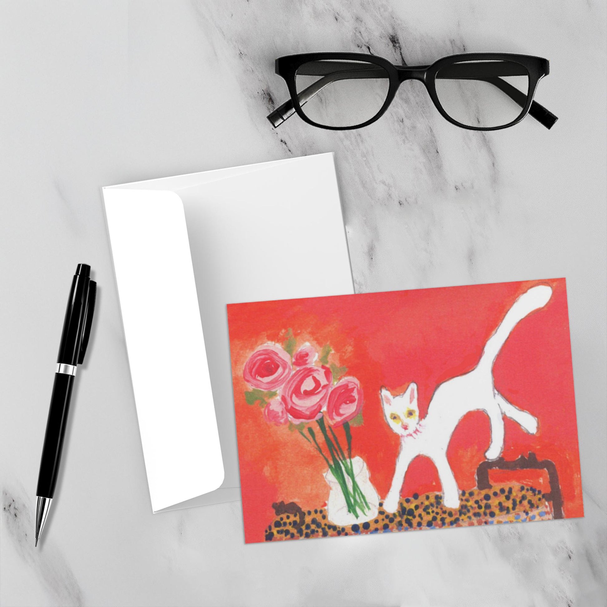 Caspar With Roses pops on this white marble backdrop surrounded by the envelope, a pen and reading glasses in this mockup,