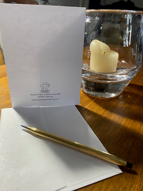 Back of Pavement Patrol greeting card with a gold pen and its envelope.