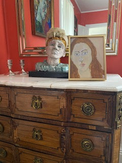 Framed print of Portrait Girl on chest of drawers.
