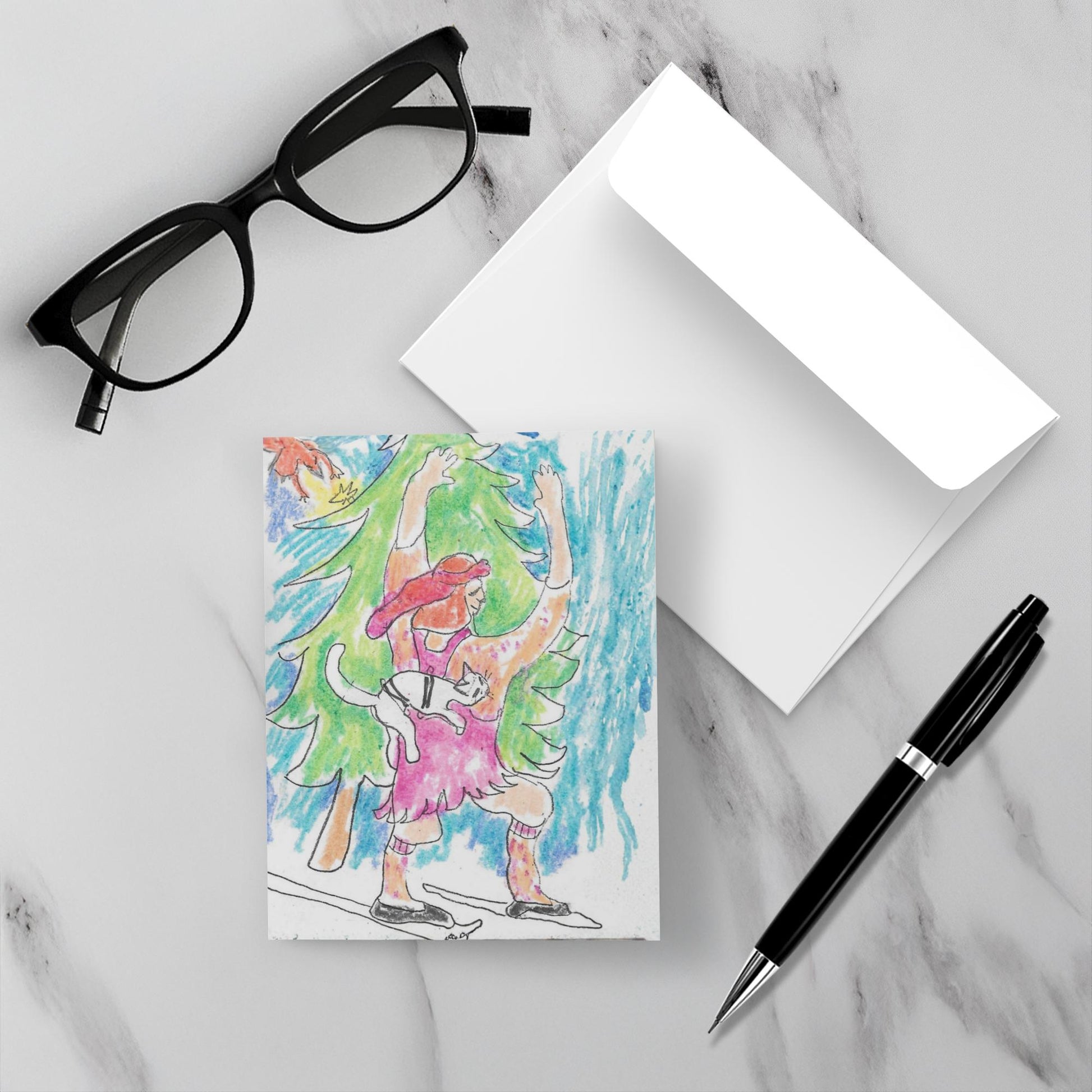 Skiing Caspar card with envelope on a white marble surface with glasses and a pen