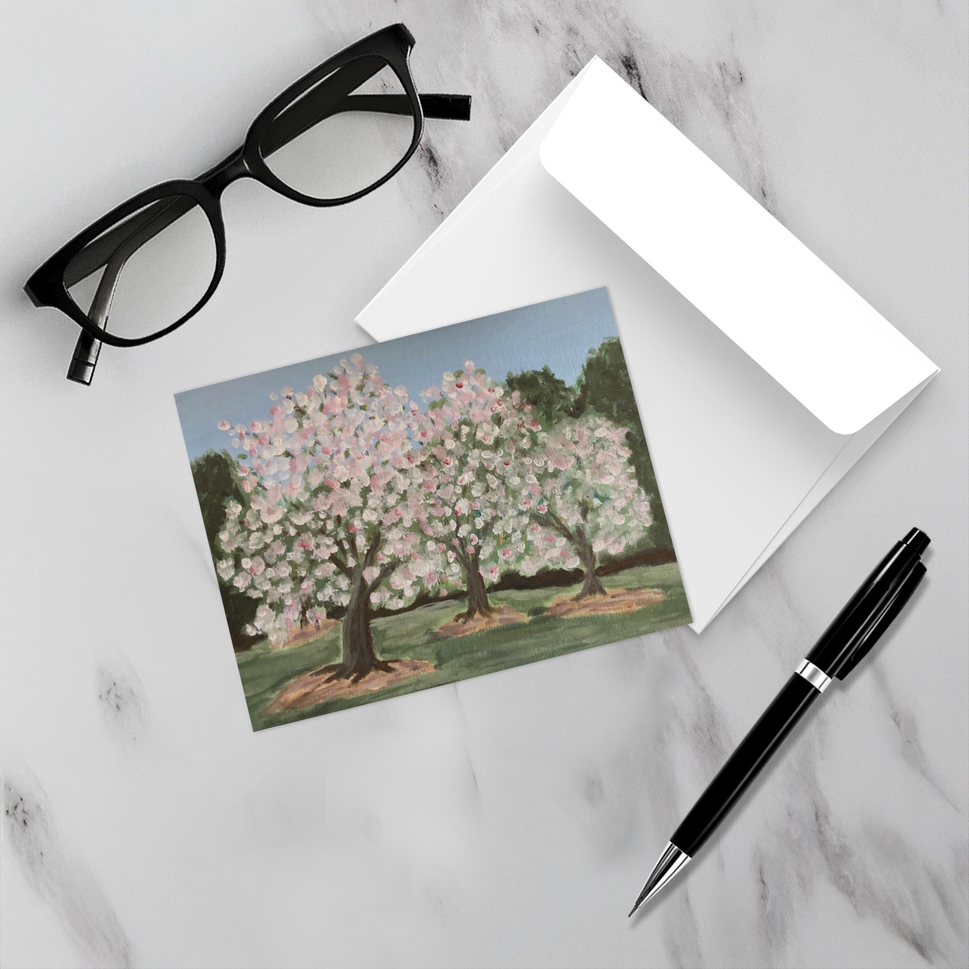 Placed on a white marble backdrop the burst of flowering trees does indeed Spring Forth in this mockup.
